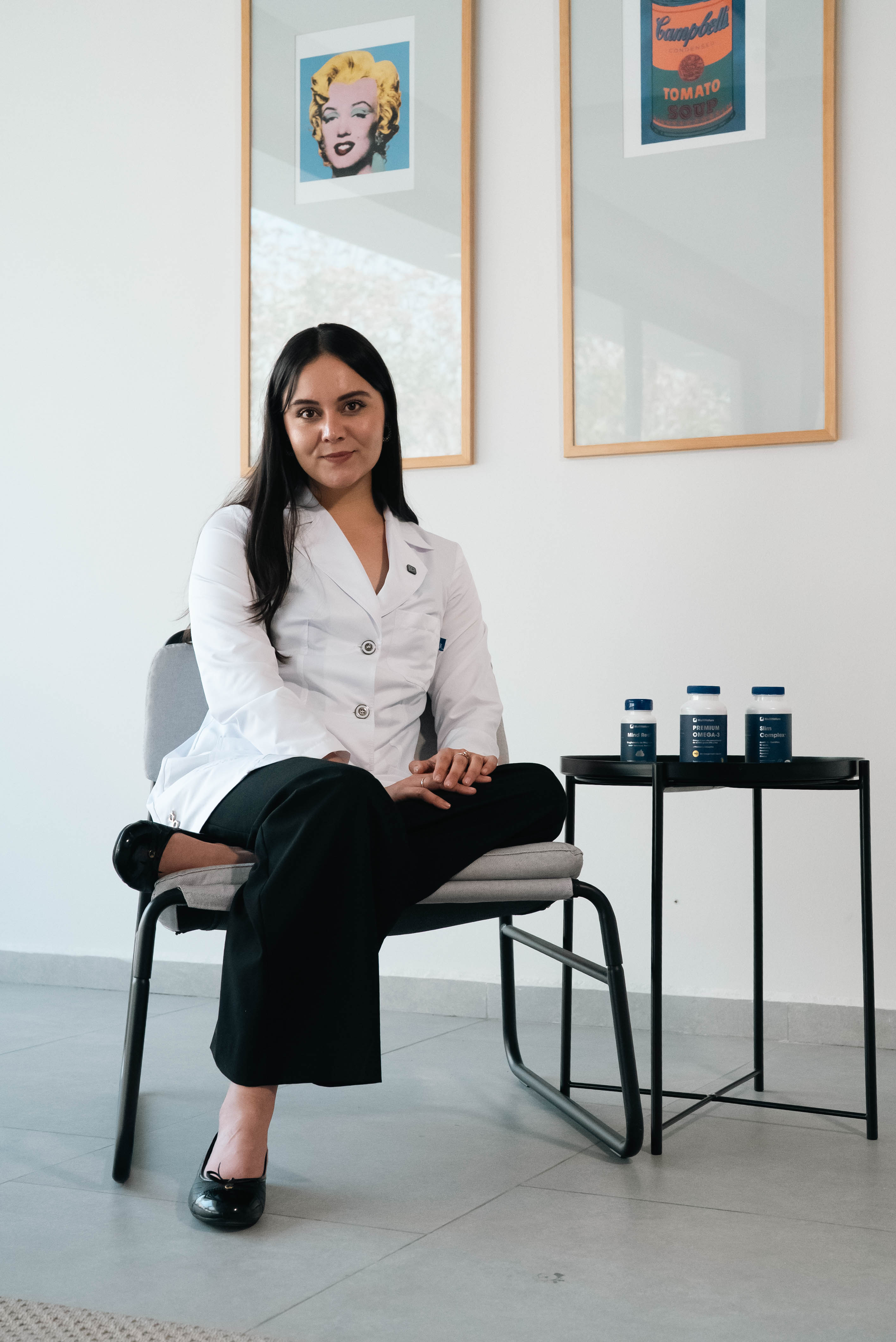 Health professional with Multinature supplements in a consultation room